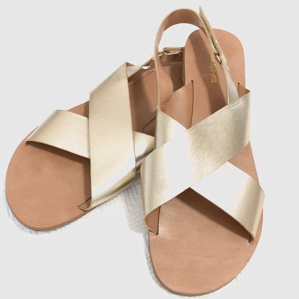 SOLD. gold crossed sandals | american eagle.